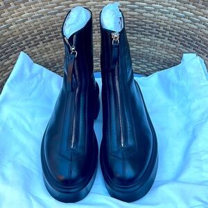 The Row black leather zipper boots